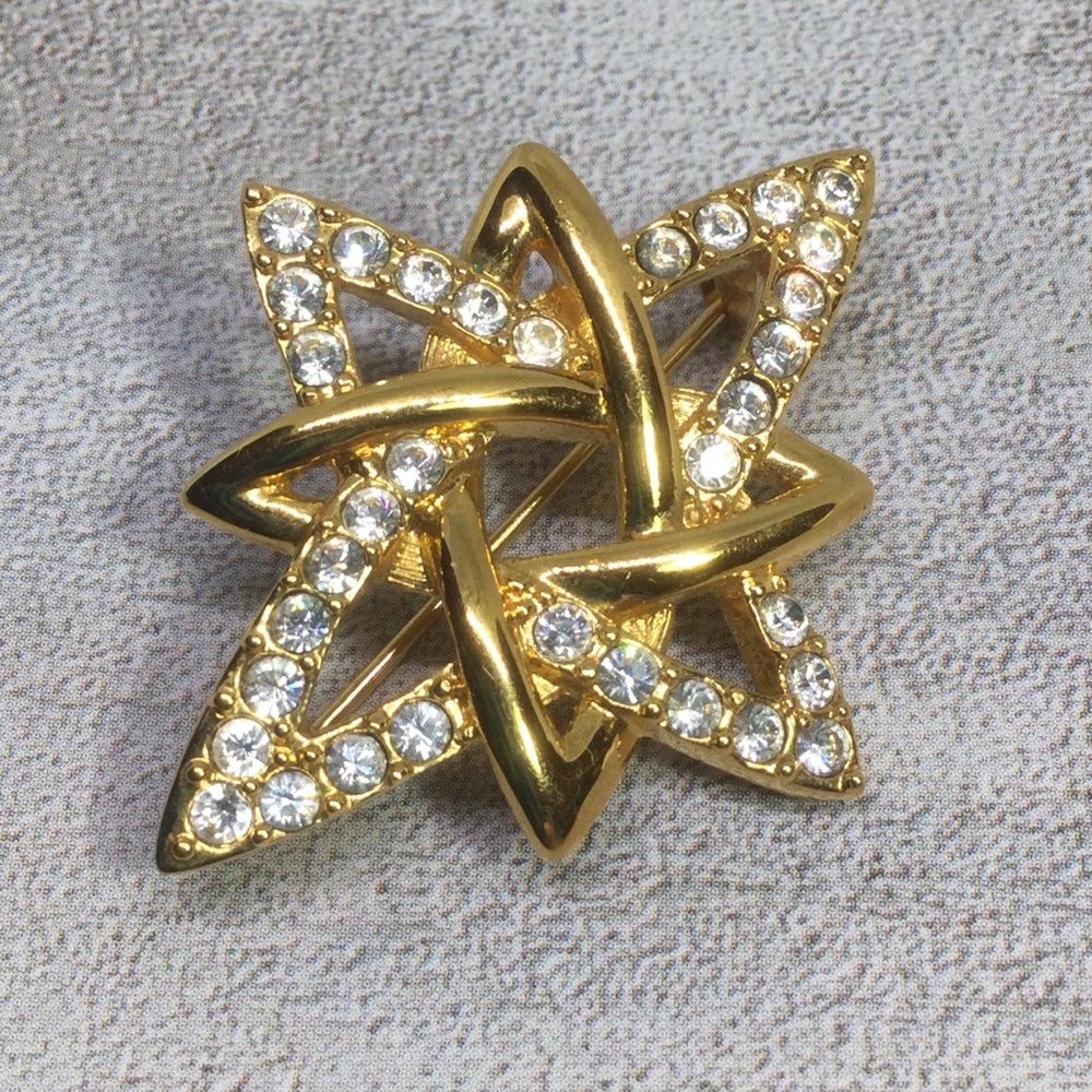 Vintage Monet Gold-Tone Starburst Brooch with Rhinestones
